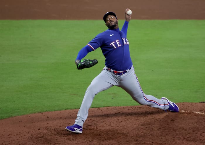 Texas Rangers pitcher Aroldis Chapman throws a pitch during the seventh inning of Game 7 of the ALCS against the Houston Astros at Minute Maid Park.